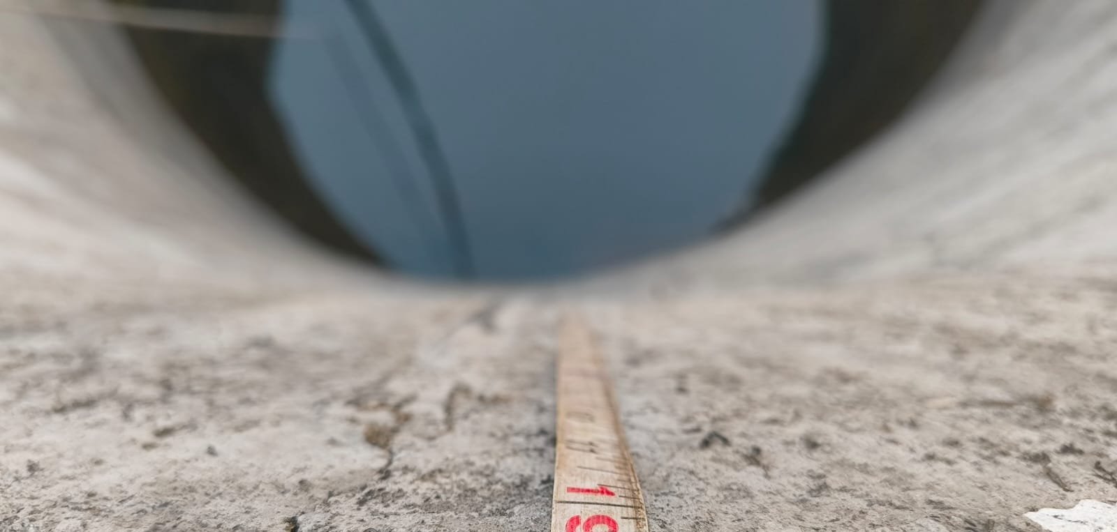 Measuring the water level at a village well — Chinchavali, Maharashtra, March 2026.