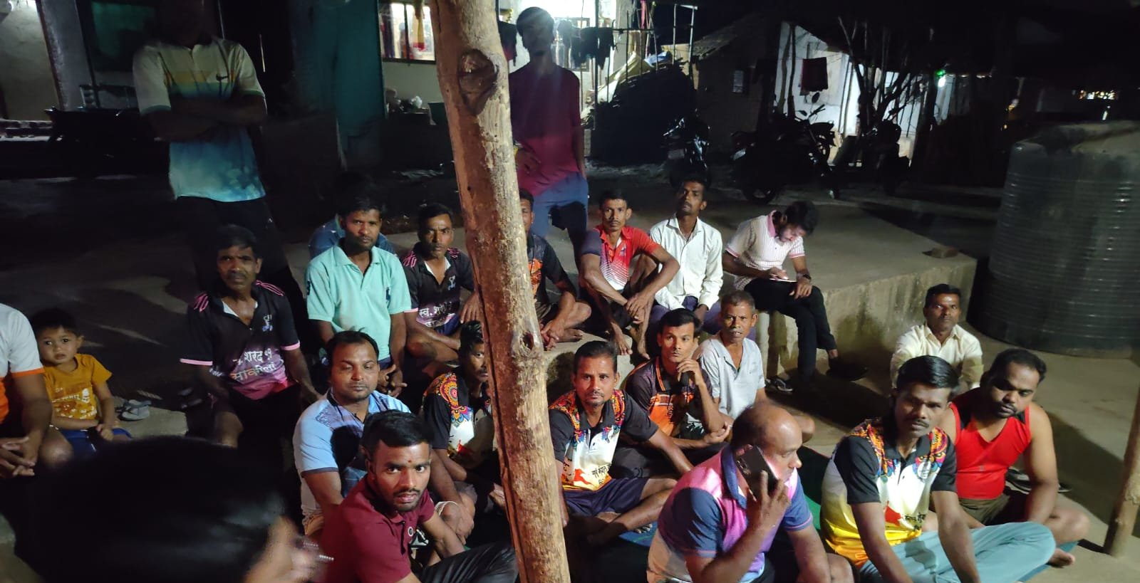 Evening community meeting during the household survey — Savaroli, Maharashtra, March 2026.